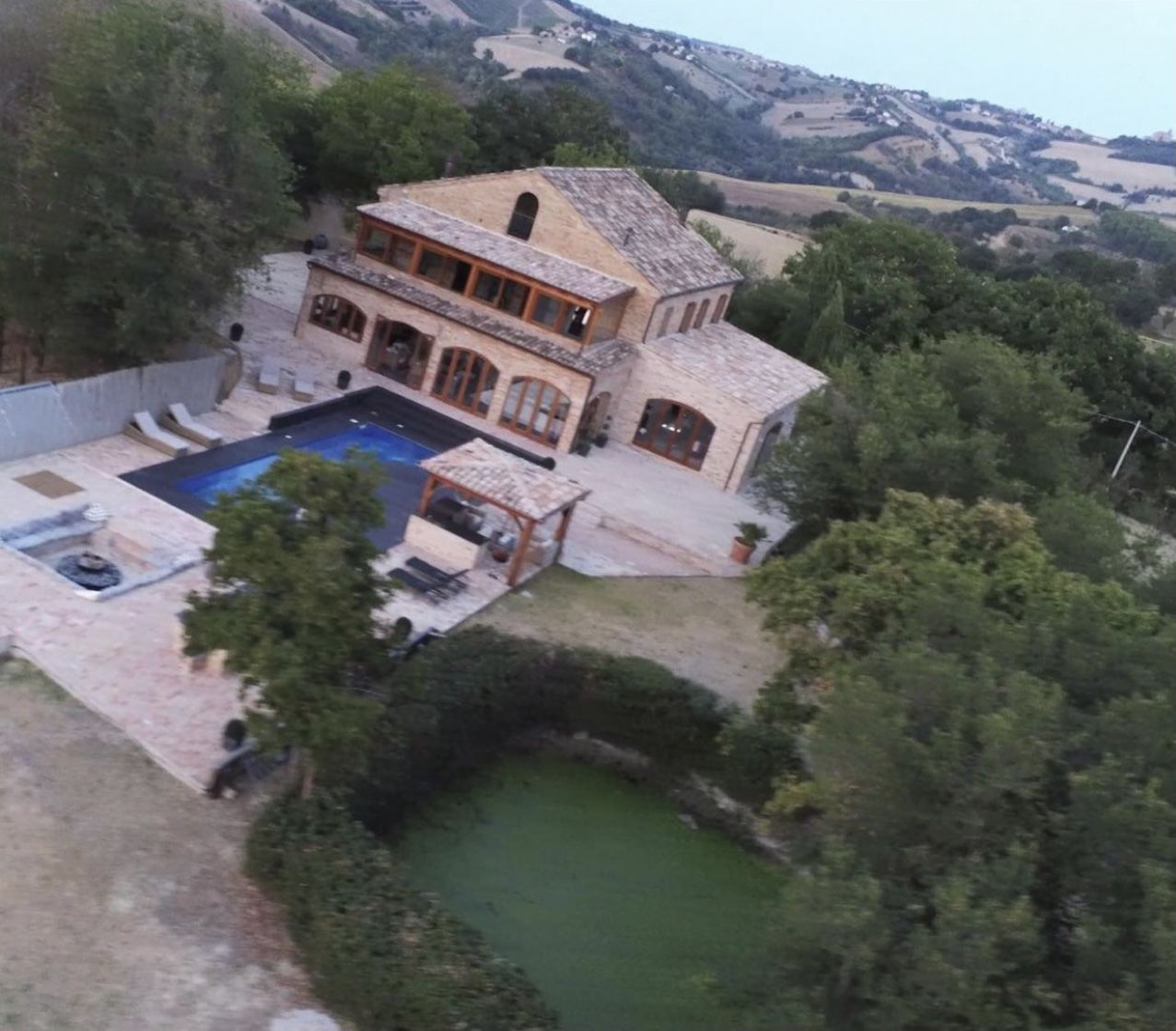 Villa Lume seen from above, alone on its hill
