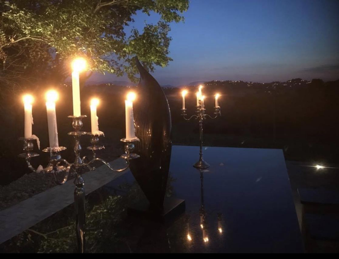 Candles lit on the terrace at night