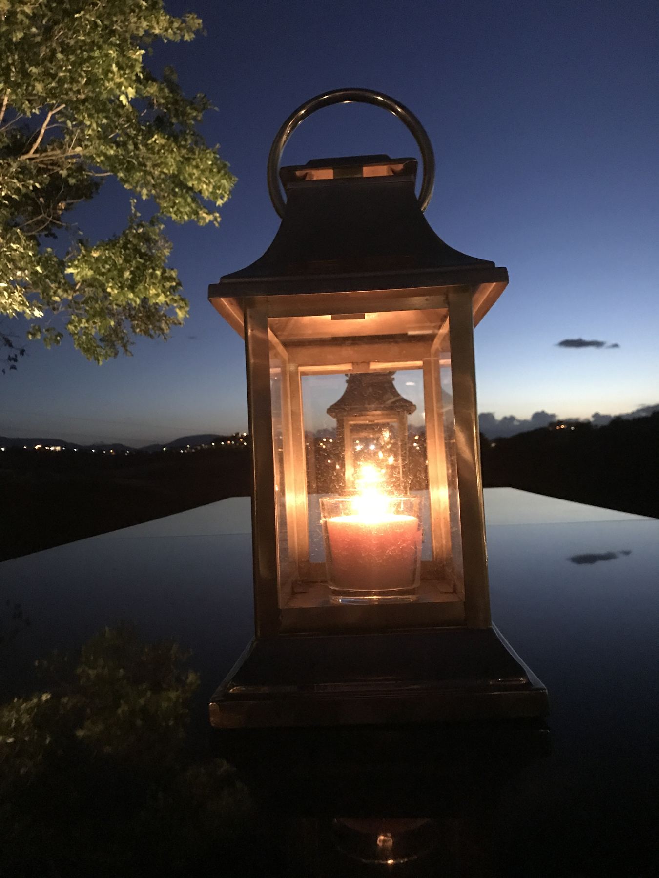 A lantern glowing at dusk