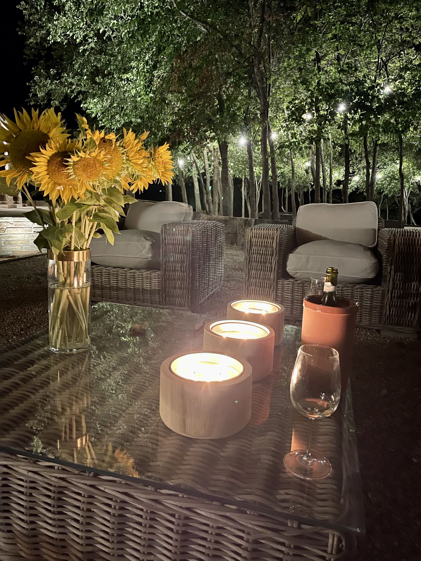 Candles lit on the garden table